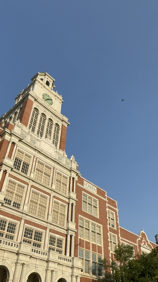 Close view of the terra cotta detailing and clock face at the top of the East High School tower