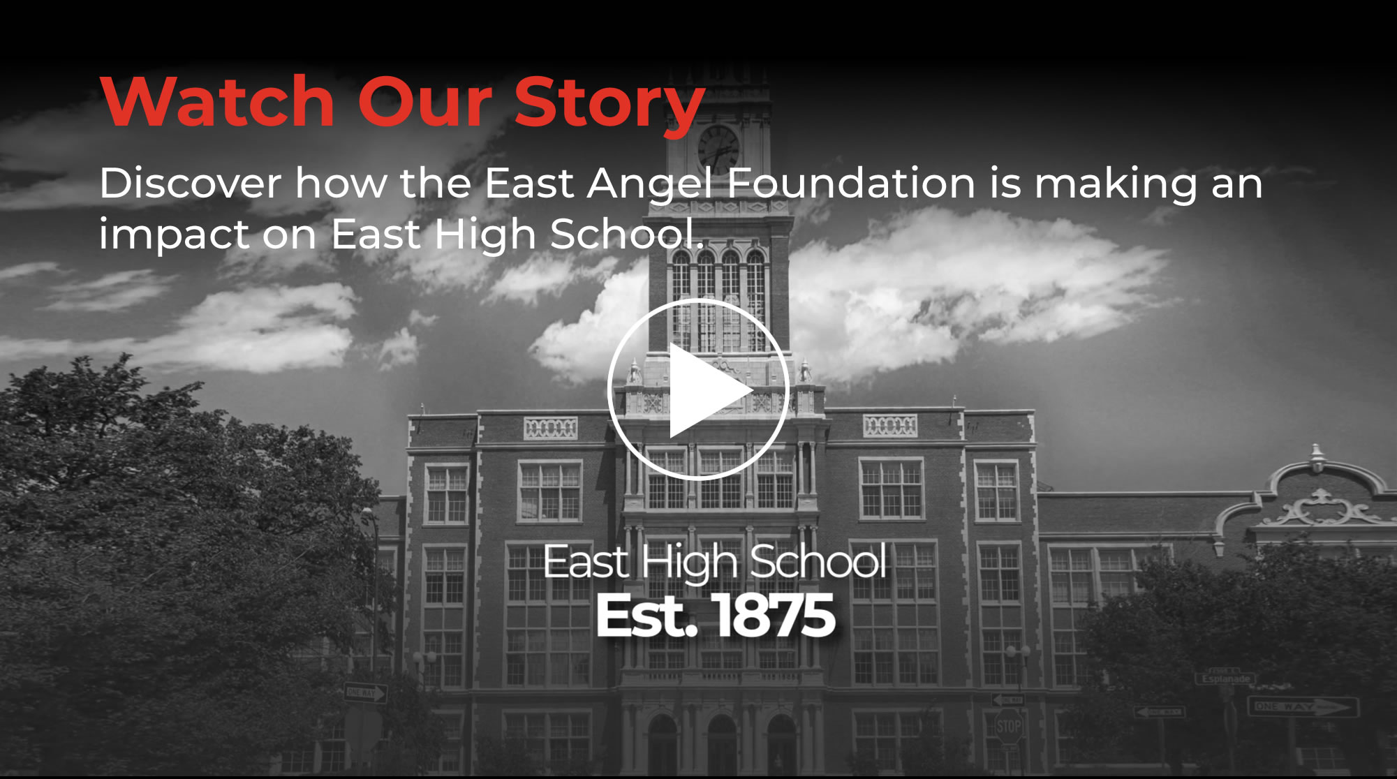 Aerial view of East High School's historic tower and campus in Denver, Colorado